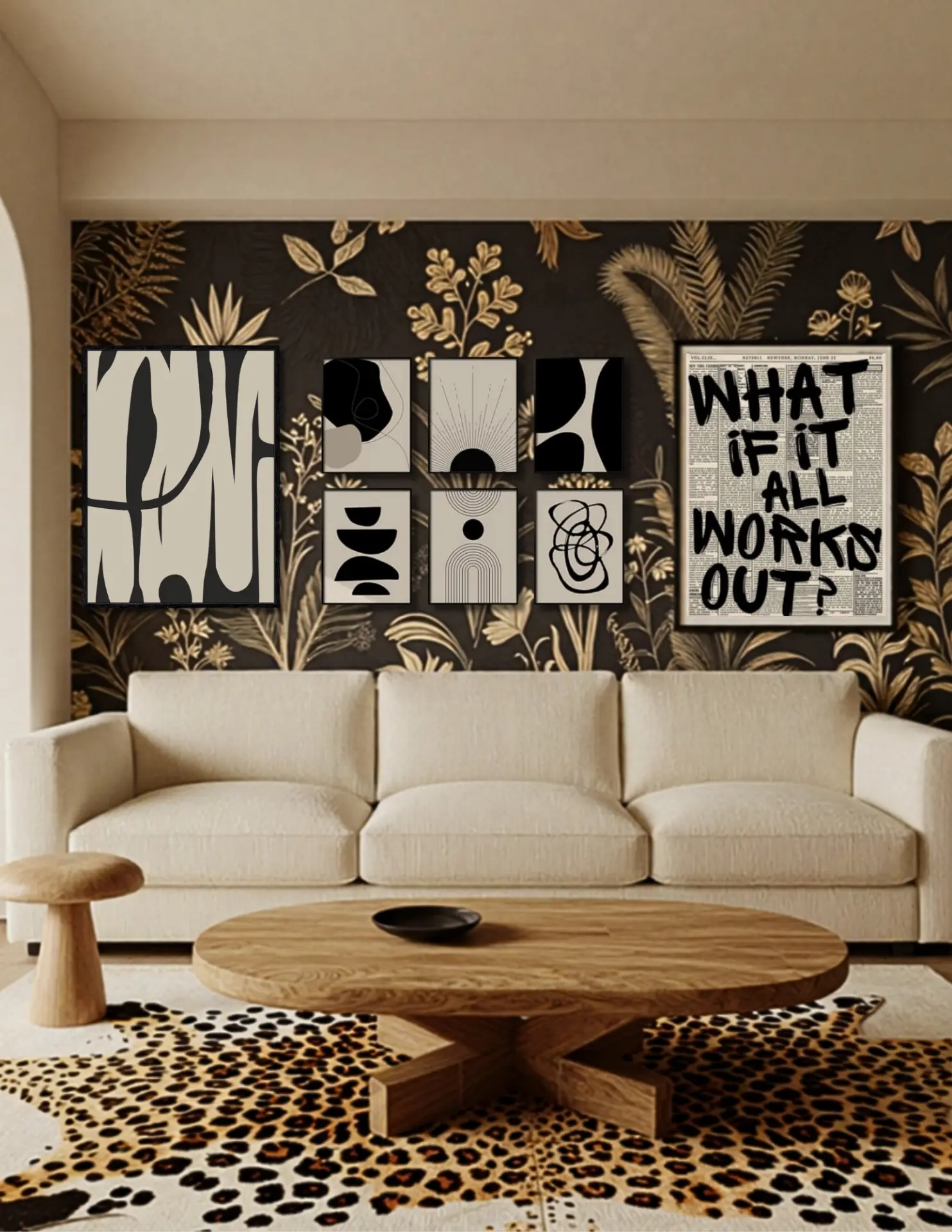 Living room with a cream sofa, botanical wallpaper, black-and-white gallery wall, sculptural wood table, and leopard-patterned rug